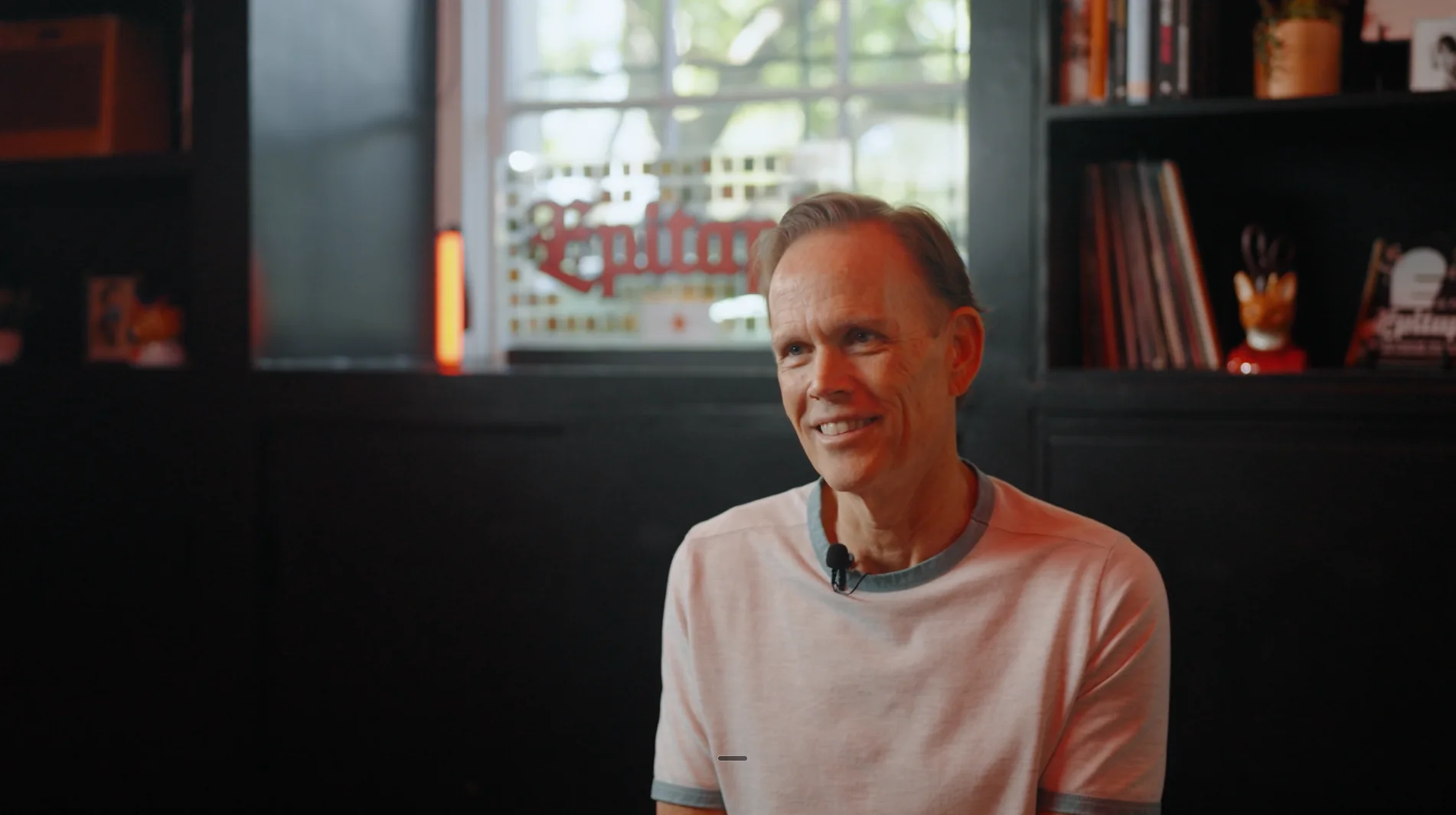 Barry Reynolds smiling with the Epitaph sign behind him