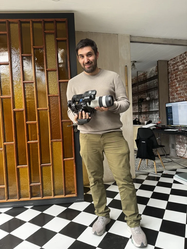 Godspeed crew member holding the production camera on location