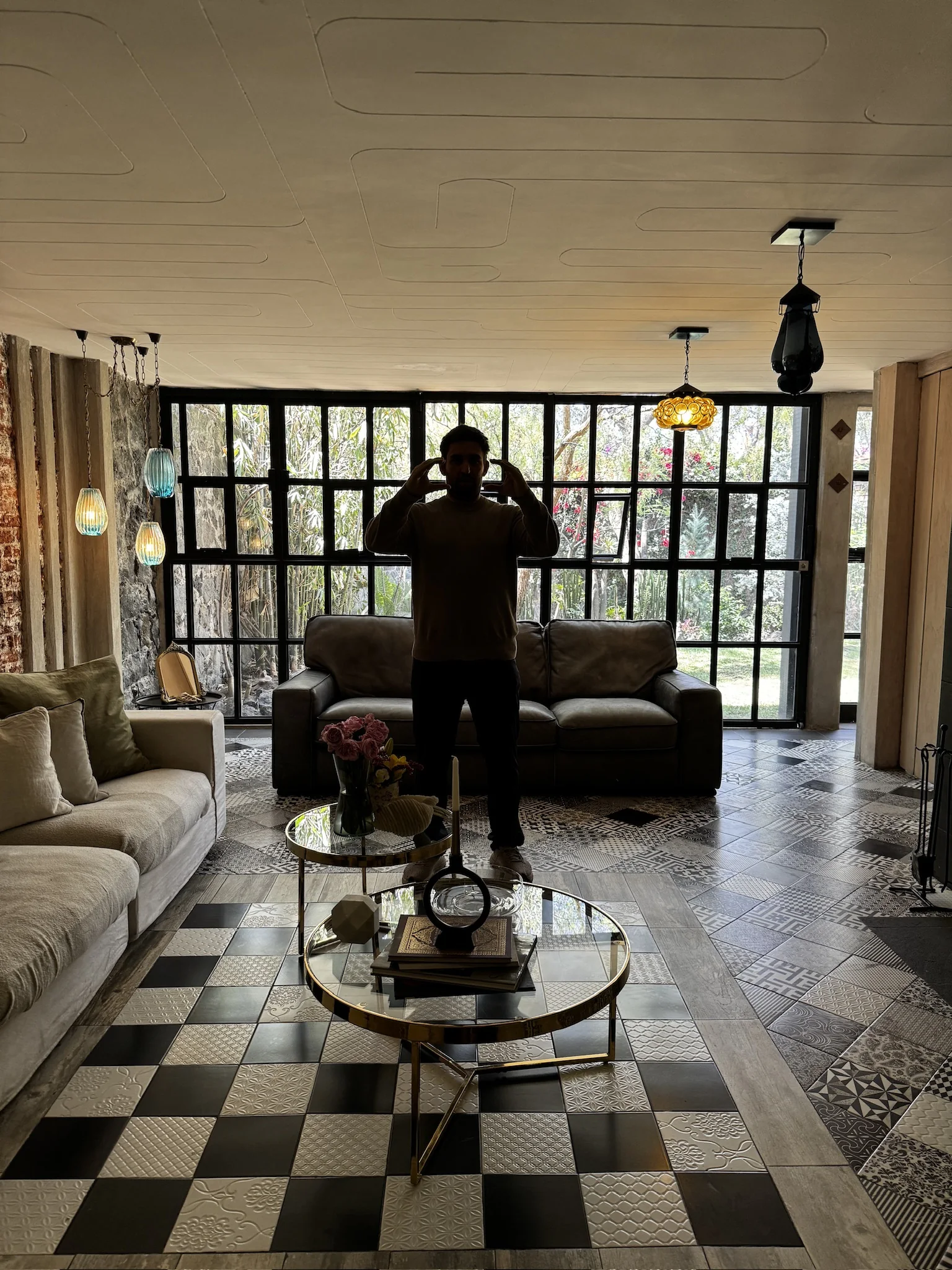 Behind-the-scenes view of the filming location with large windows and patterned floors